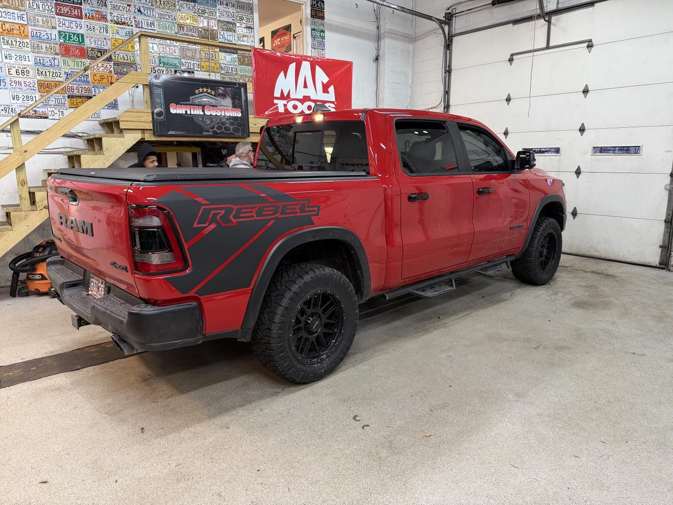 Red Dodge Ram pickup truck in garage